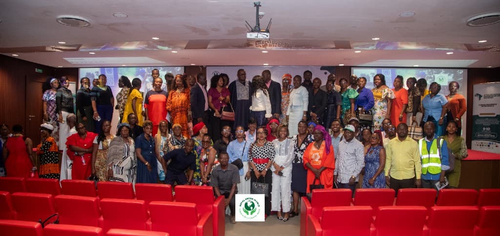 Group portrait of summit participants in the red-seat auditorium at Krystal Palace, Douala, with the Sustainable Development Goals on the screens